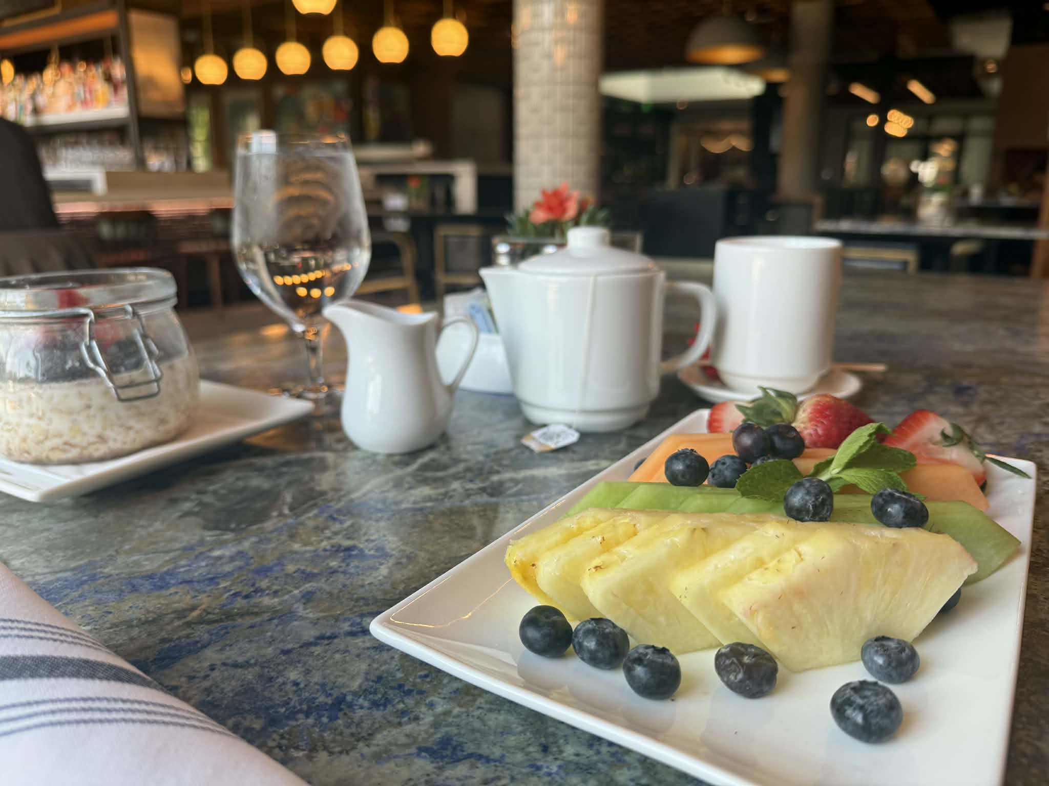 a plate of fruit and berries on a table