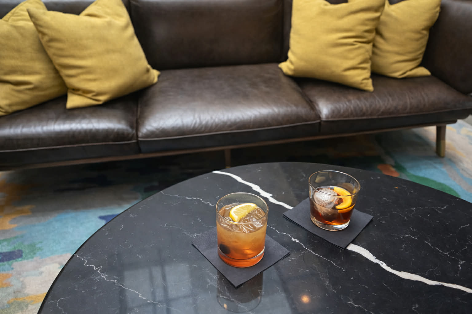 a brown leather couch in a living room