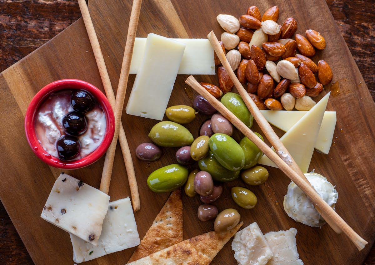 A picture of cheese and olives