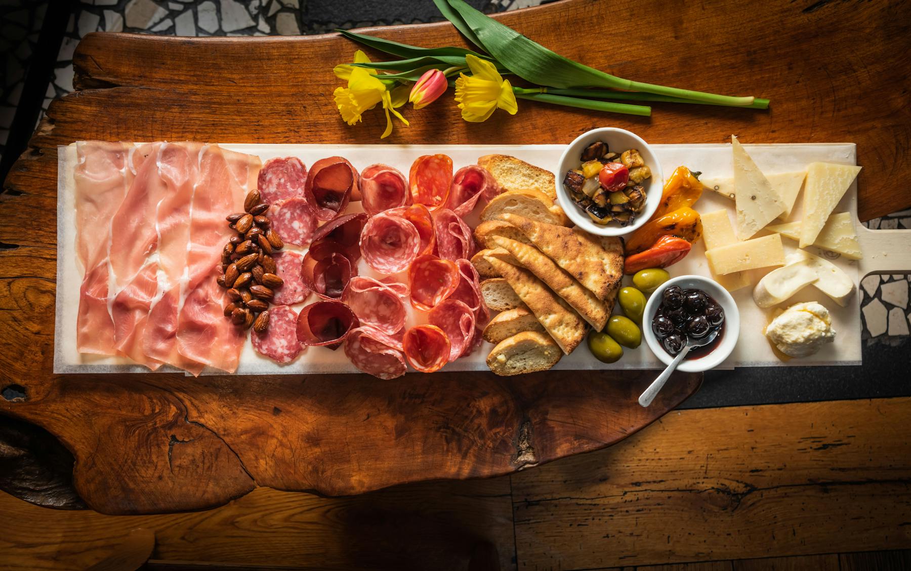 a box filled with different types of food on a wooden table