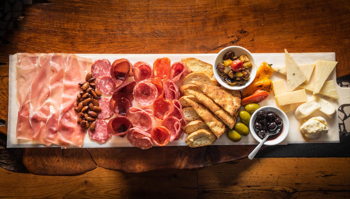 a bunch of food sitting on top of a wooden table