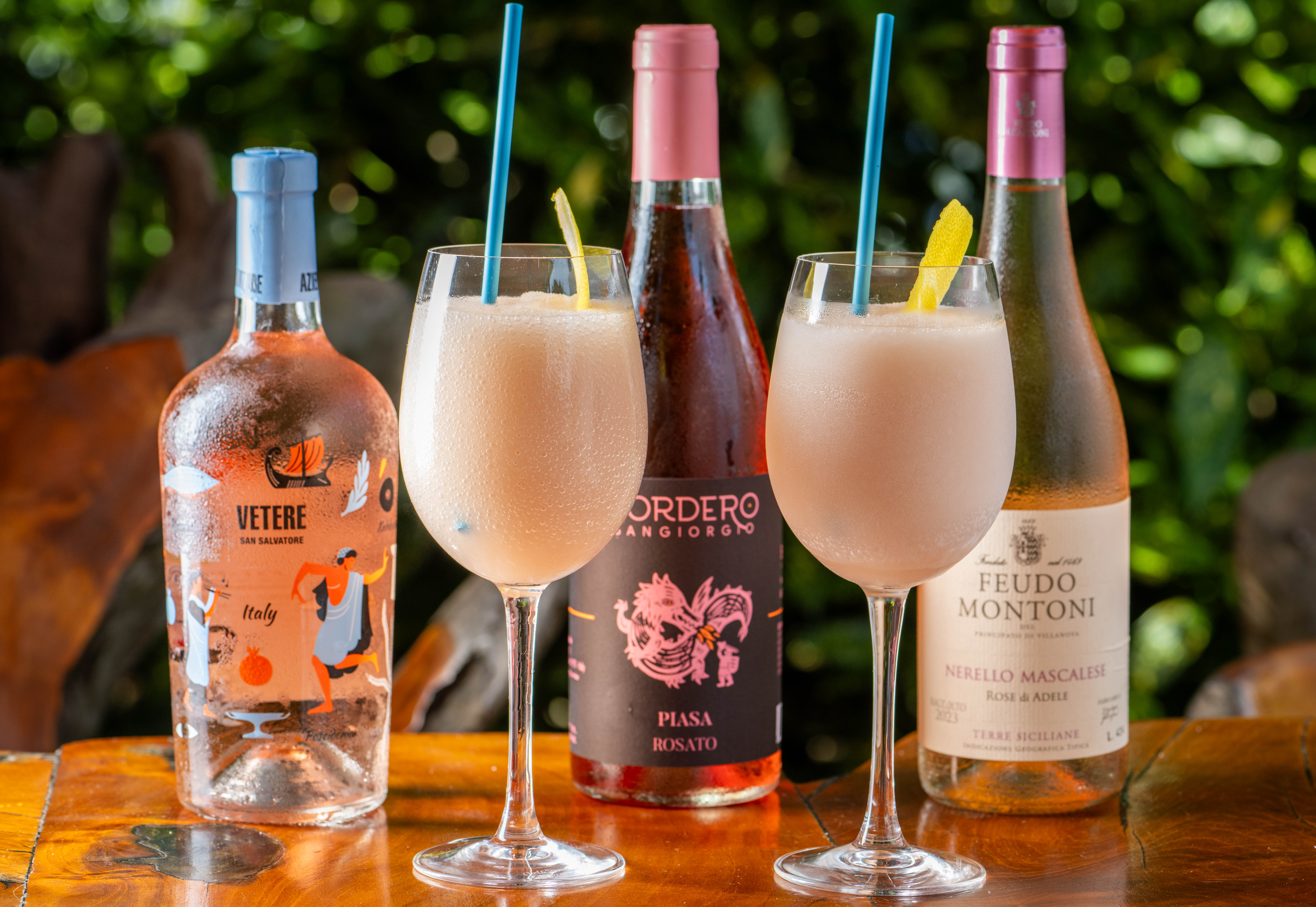 a close up of a bottle and a glass of wine