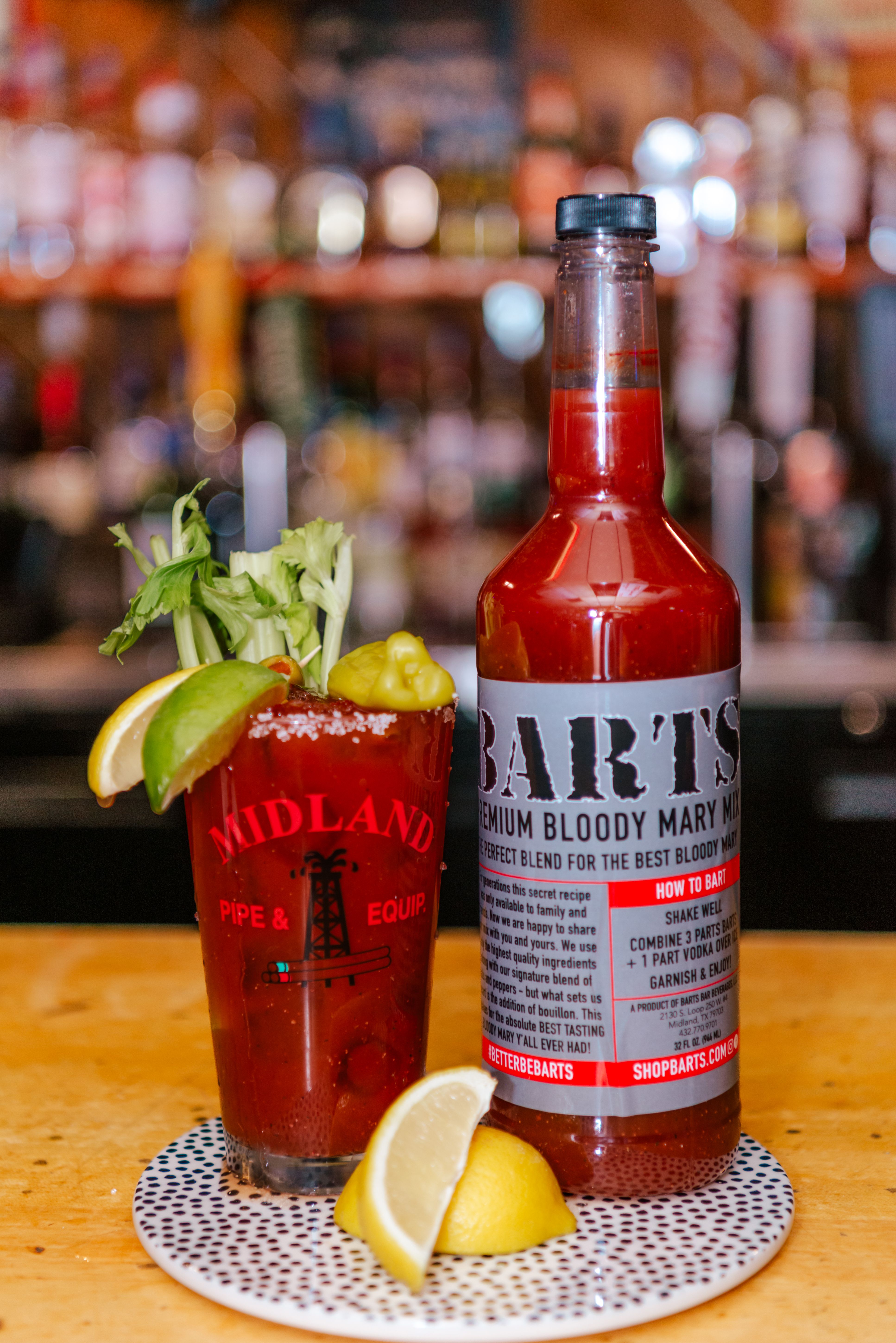 a bottle of bloody mary with a bloody drink in it