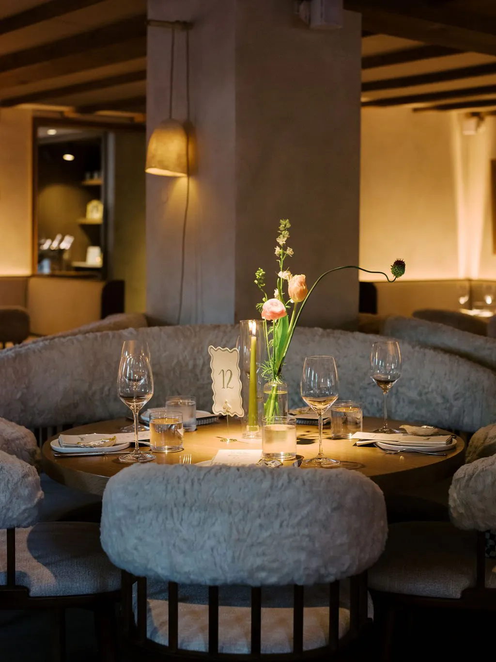 Round banquette under the wood beams