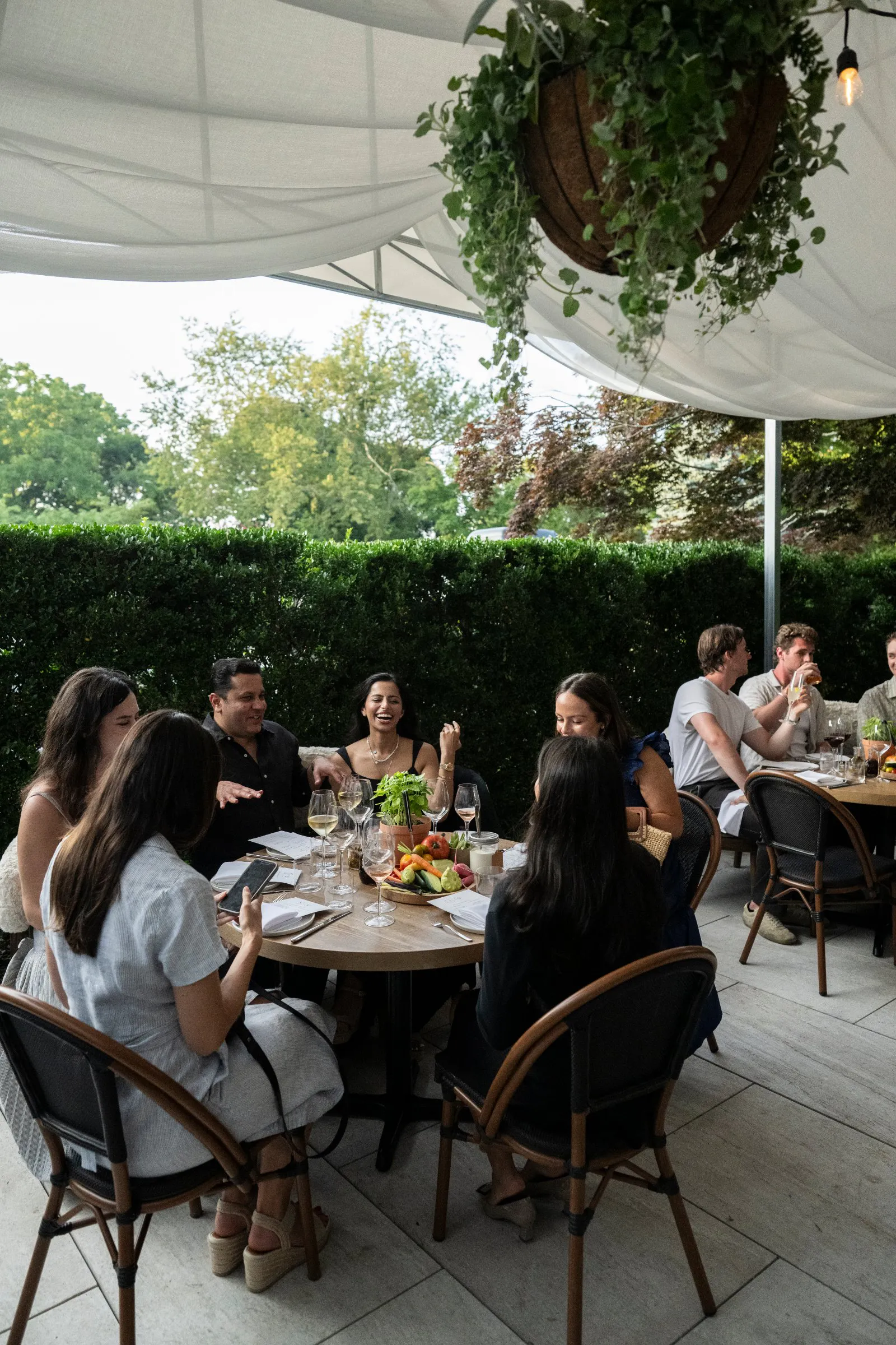 Guests at a seated dinner on the East Patio