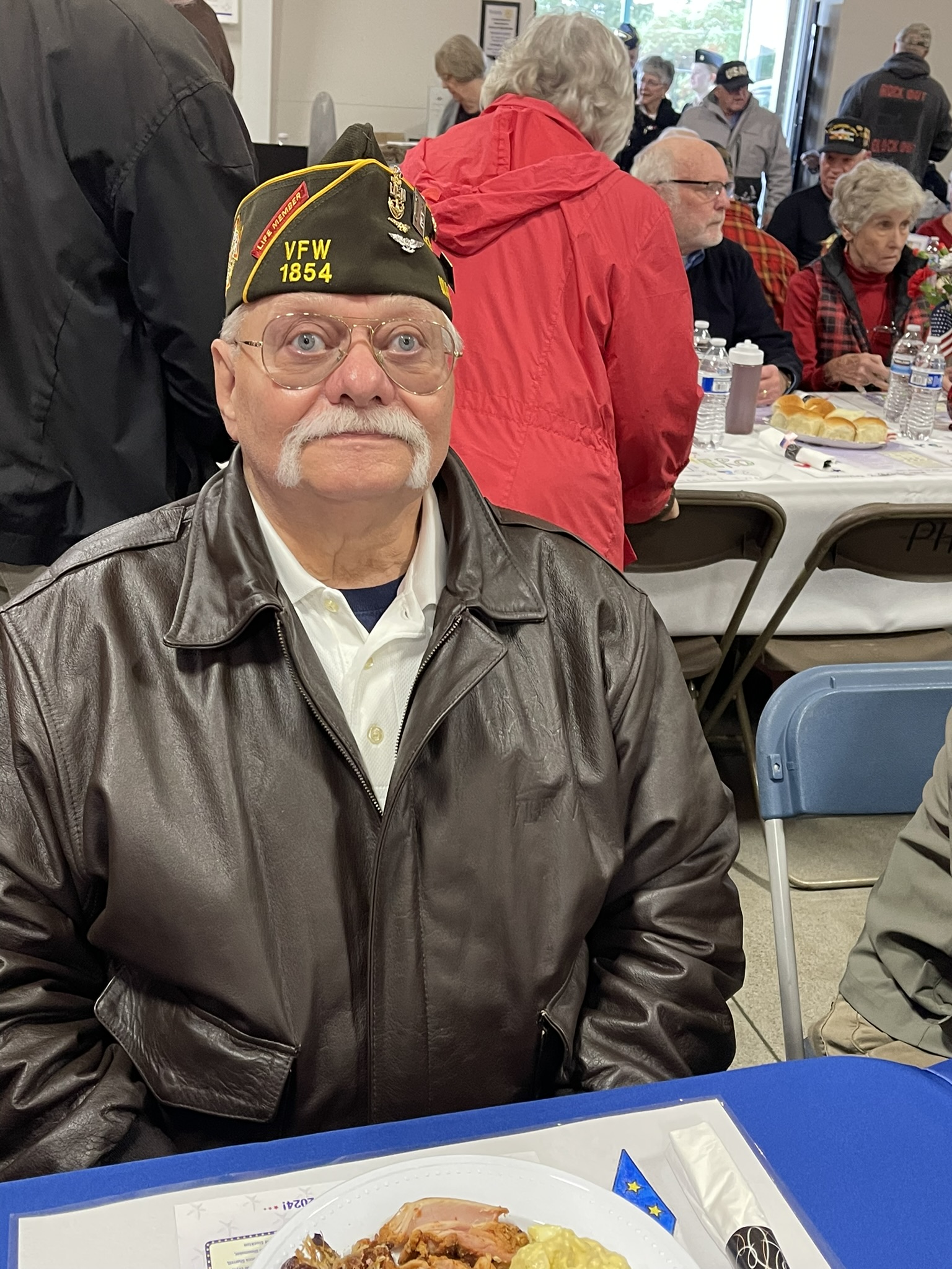 a group of people sitting at a table