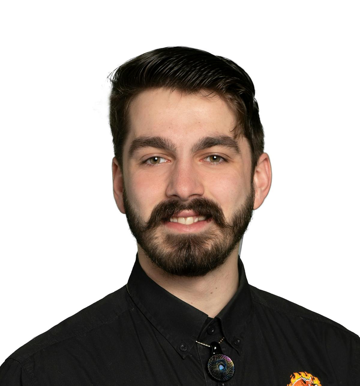 a man wearing glasses posing for the camera