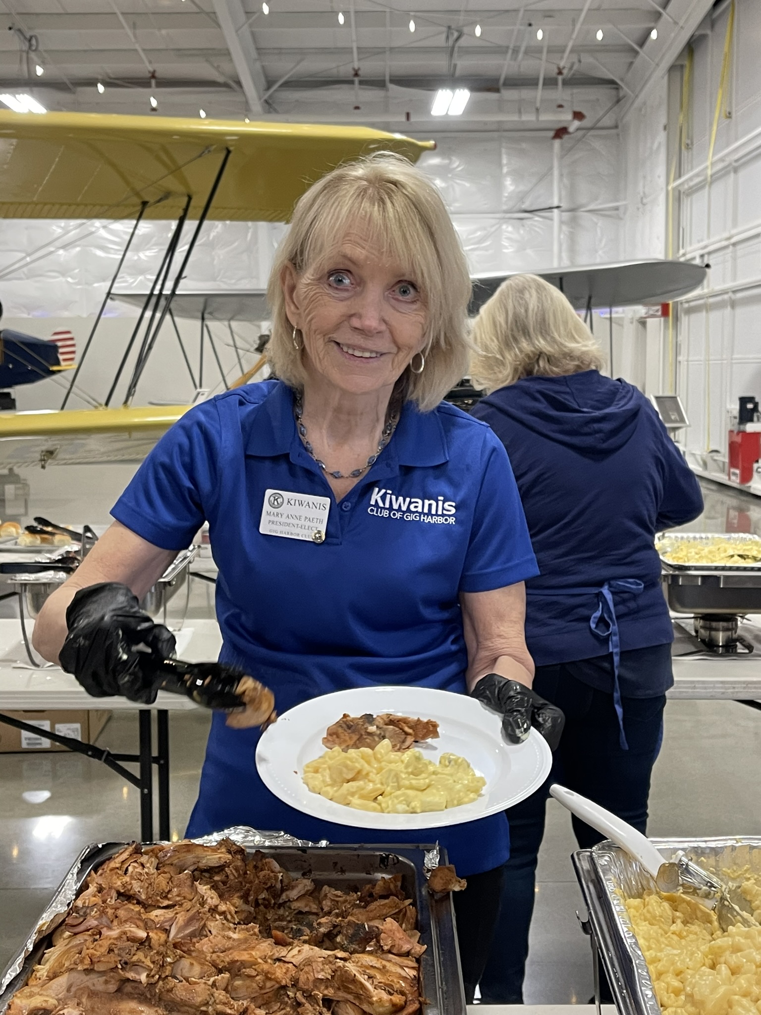 a person holding a plate of food