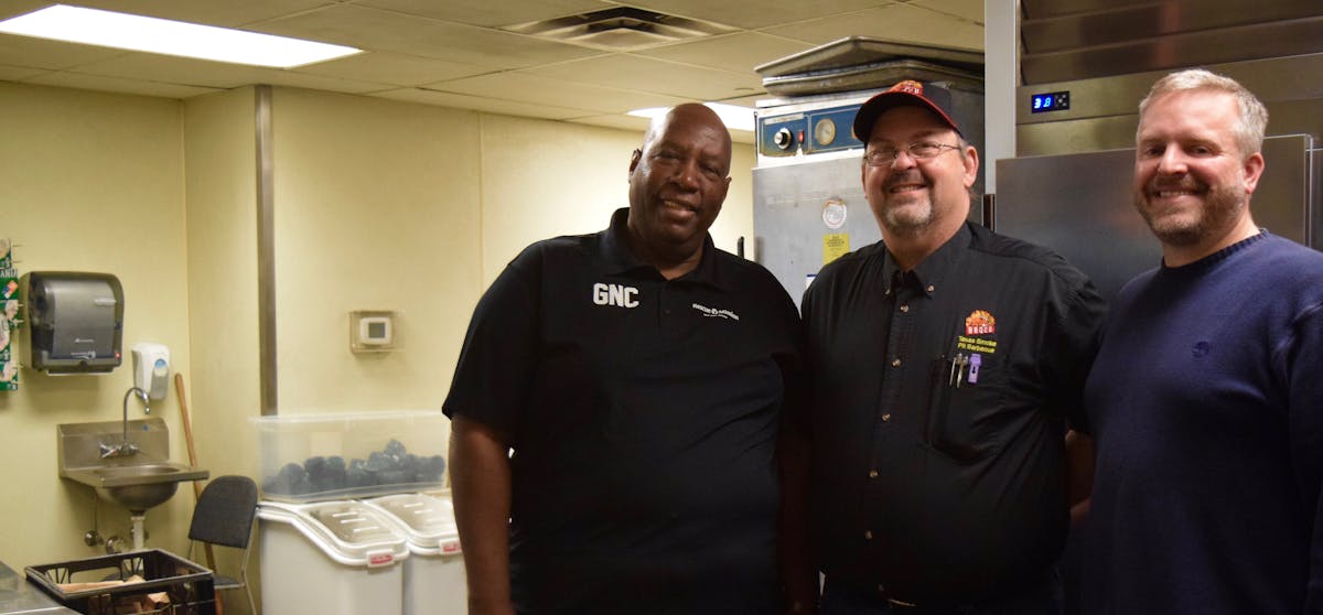 Duke Paulson standing in a kitchen