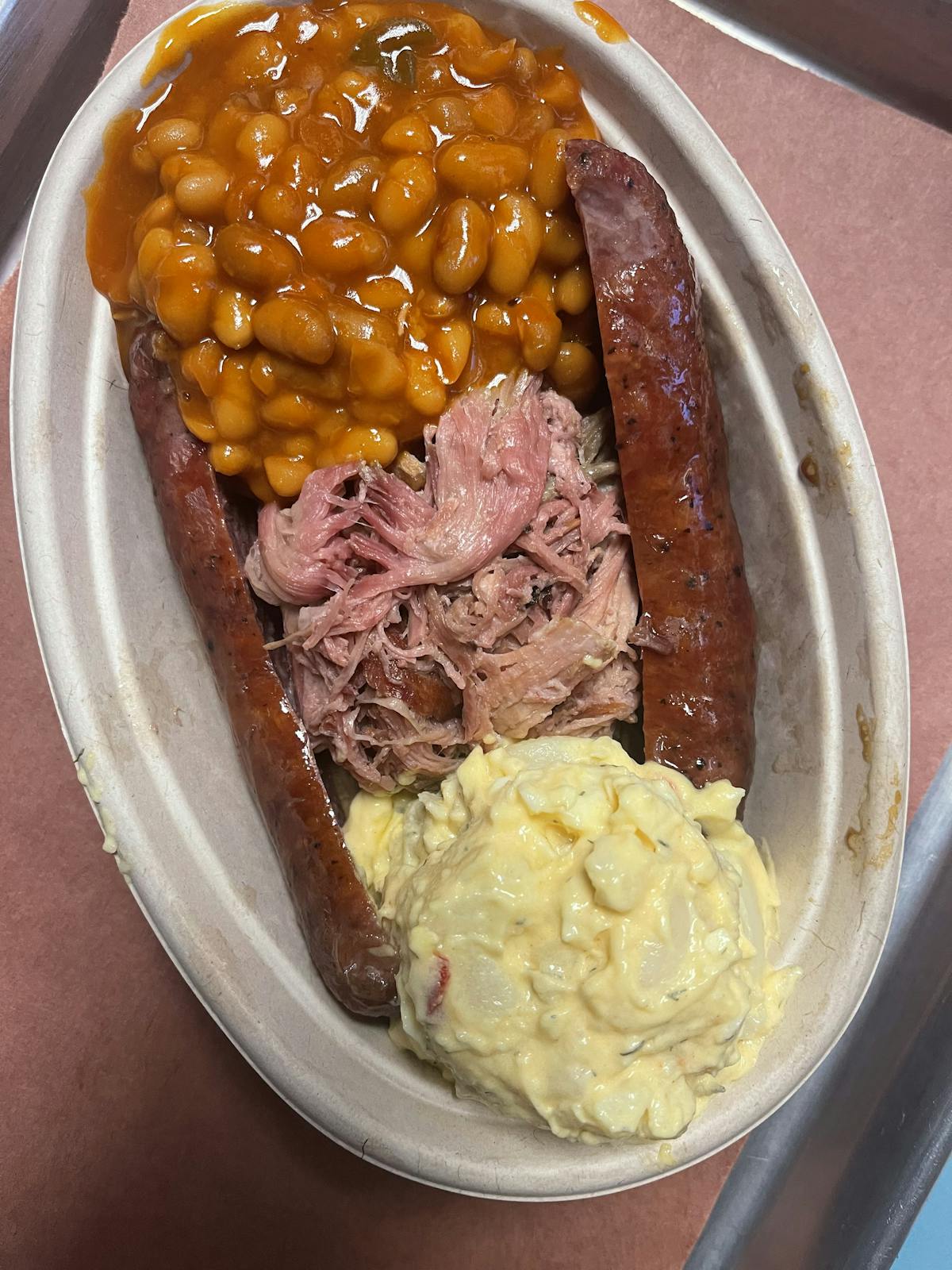 barbeque boat, pork, potato salad, beans and sausage