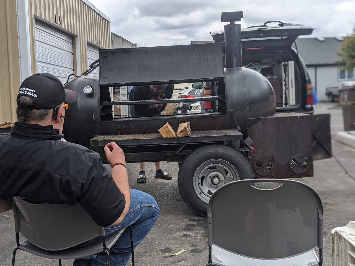 a man sitting in front of a truck