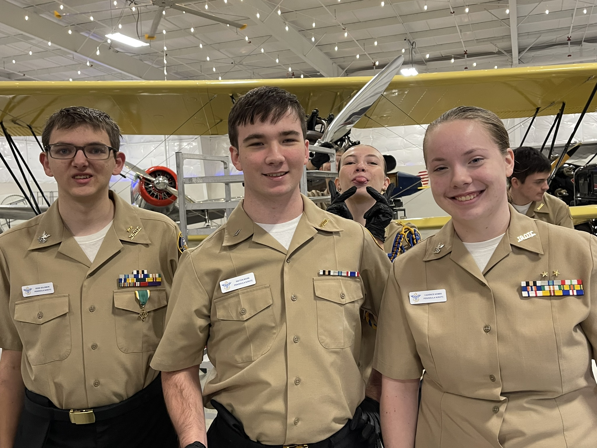 a group of people wearing military uniforms posing for a picture