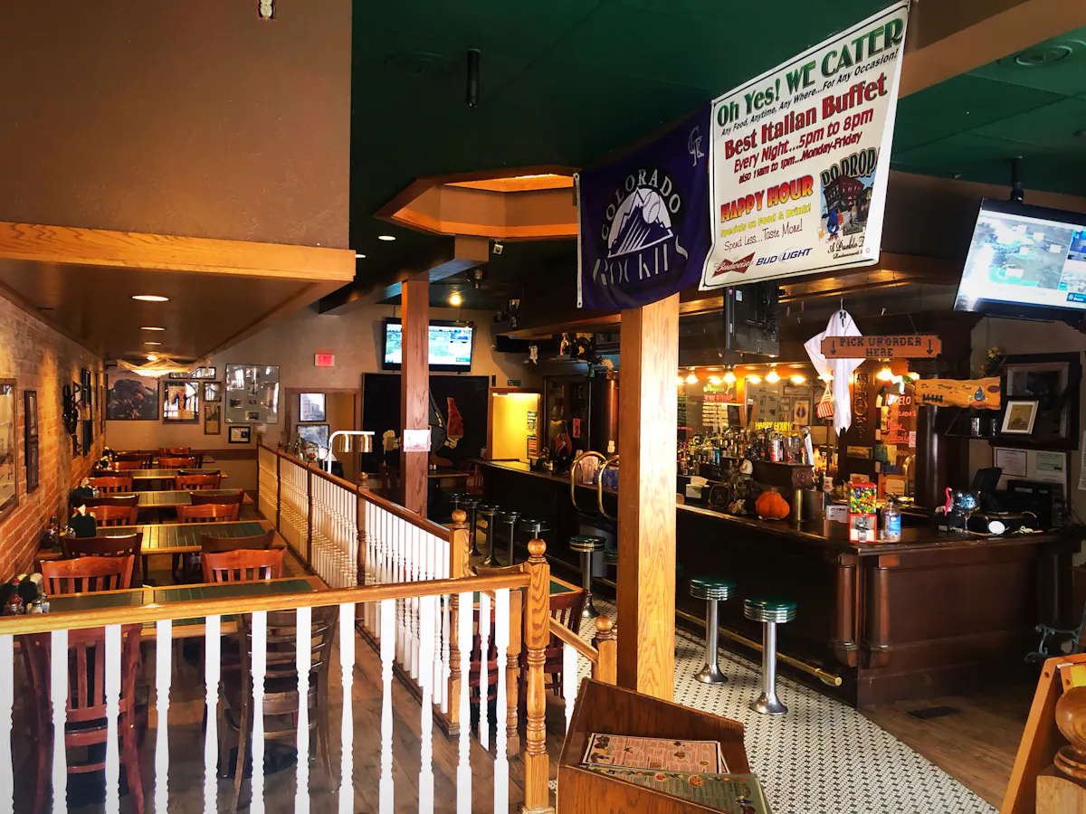 a large restaurant room filled with furniture
