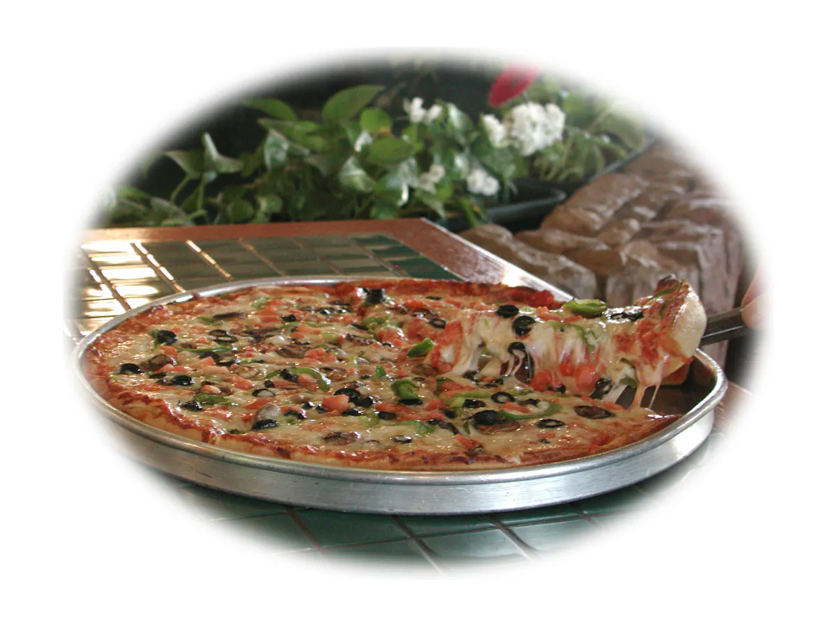 a pizza sitting on a pan