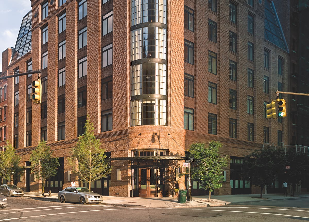 a tall building in the middle of a city street