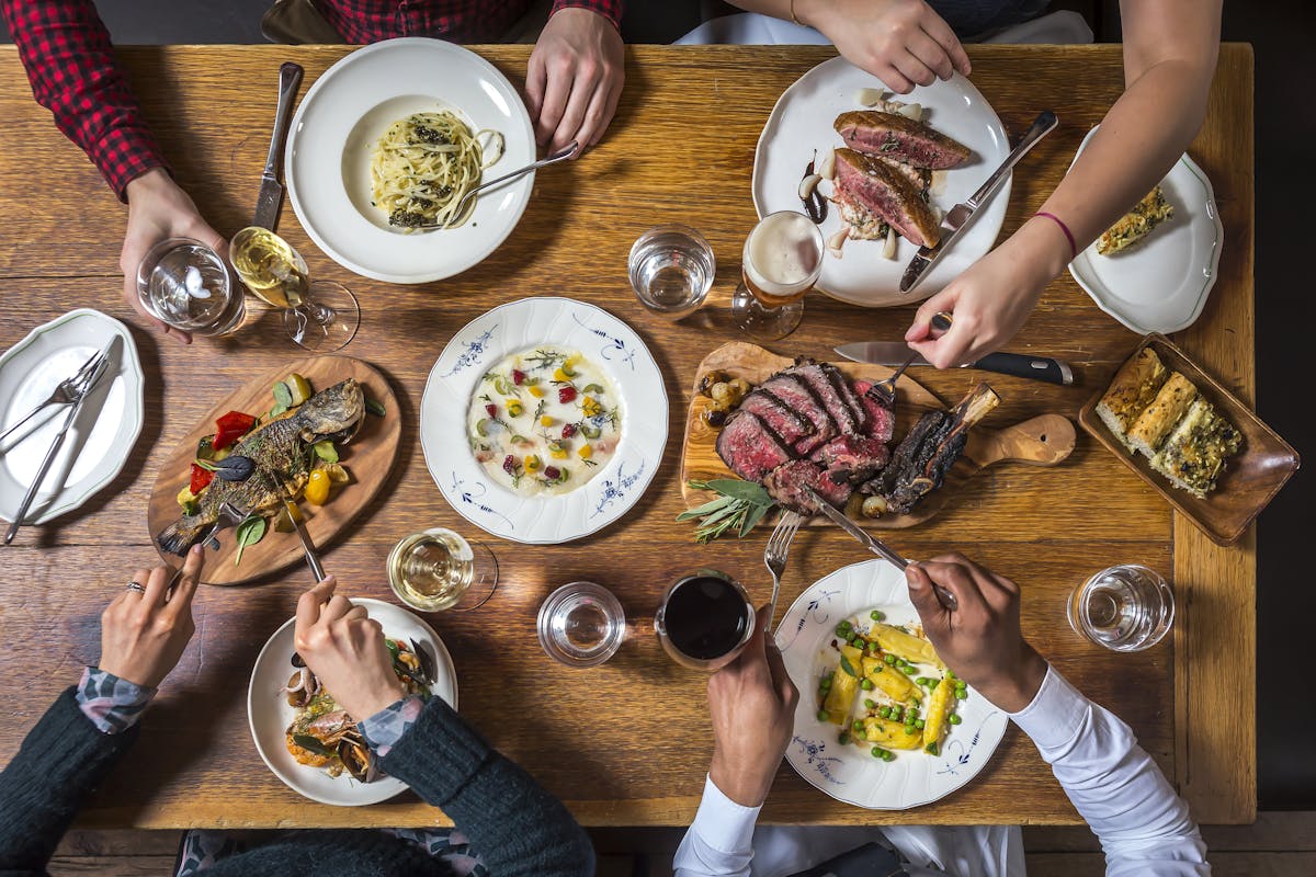 a table topped with several plates of food