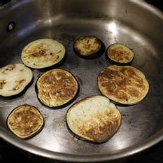 food cooking in a pan on a stove