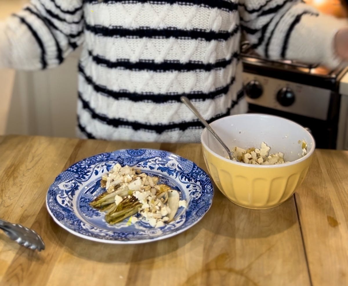 a bowl of food on a plate on a table
