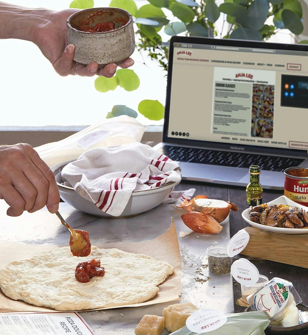 a person sitting at a table with a plate of food