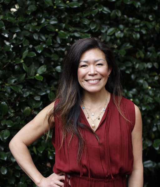 a woman smiling for the camera