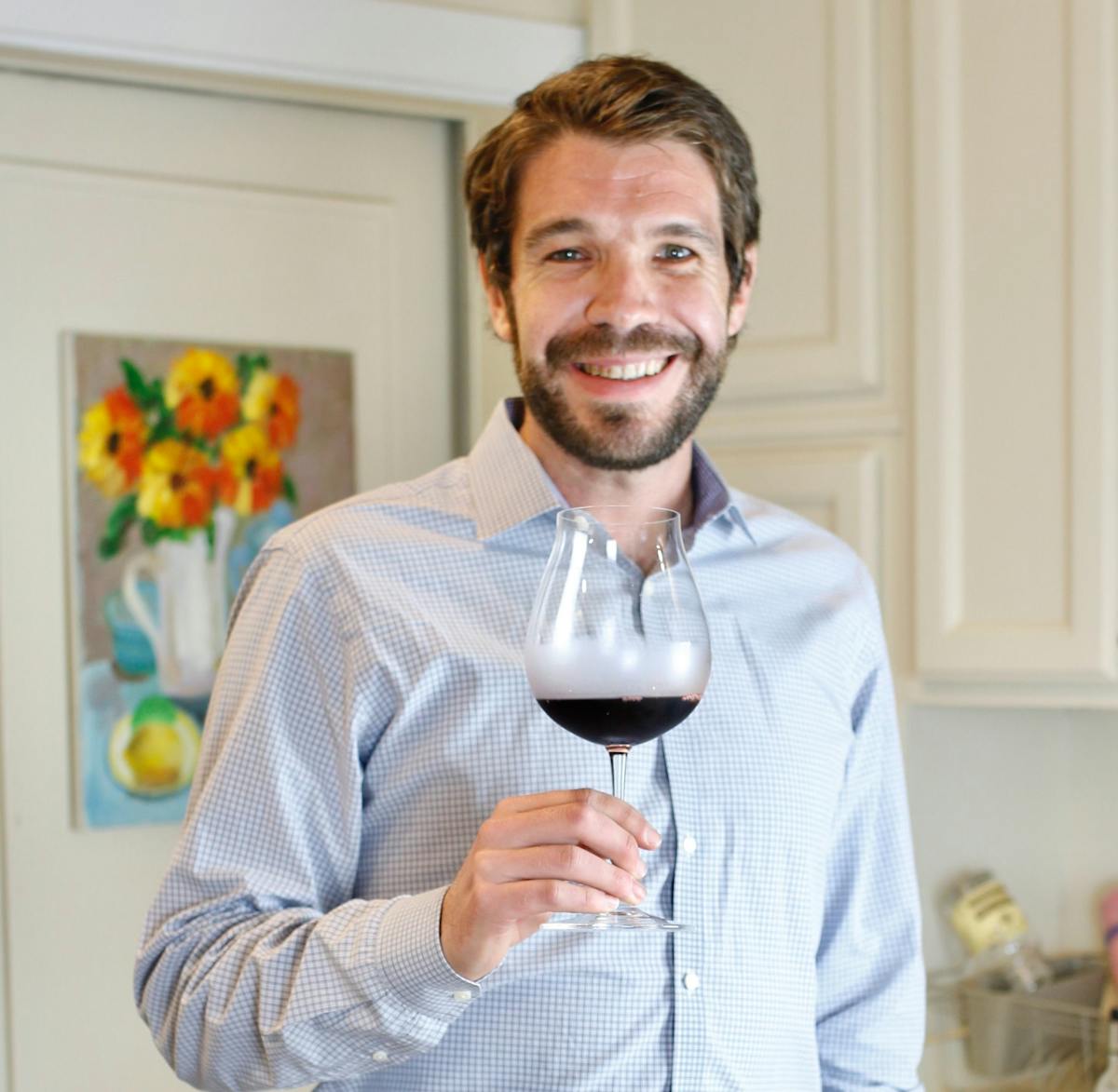 a man holding a glass of wine