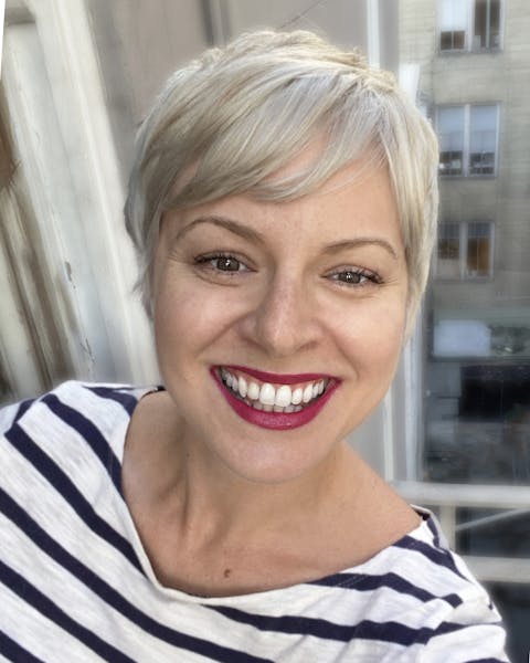 a woman smiling for the camera