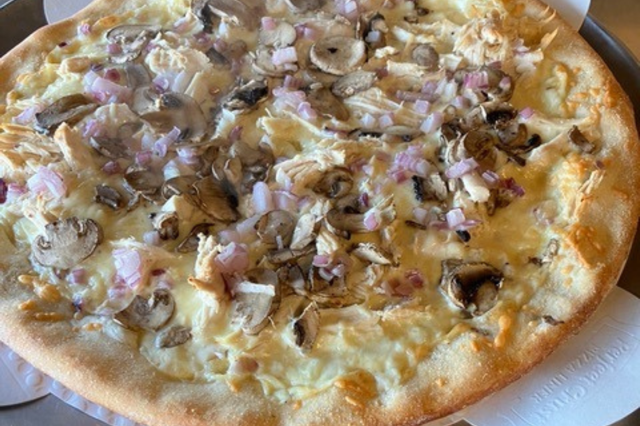 a close up of a plate of pizza