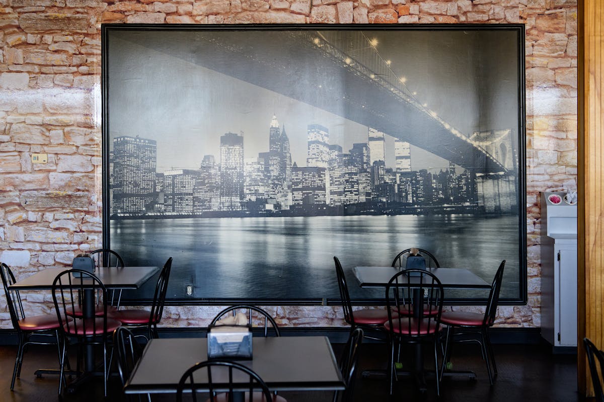 a dining room table in front of a window