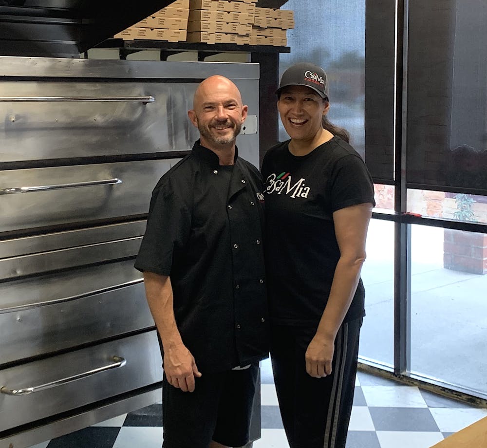 a man standing in front of a building