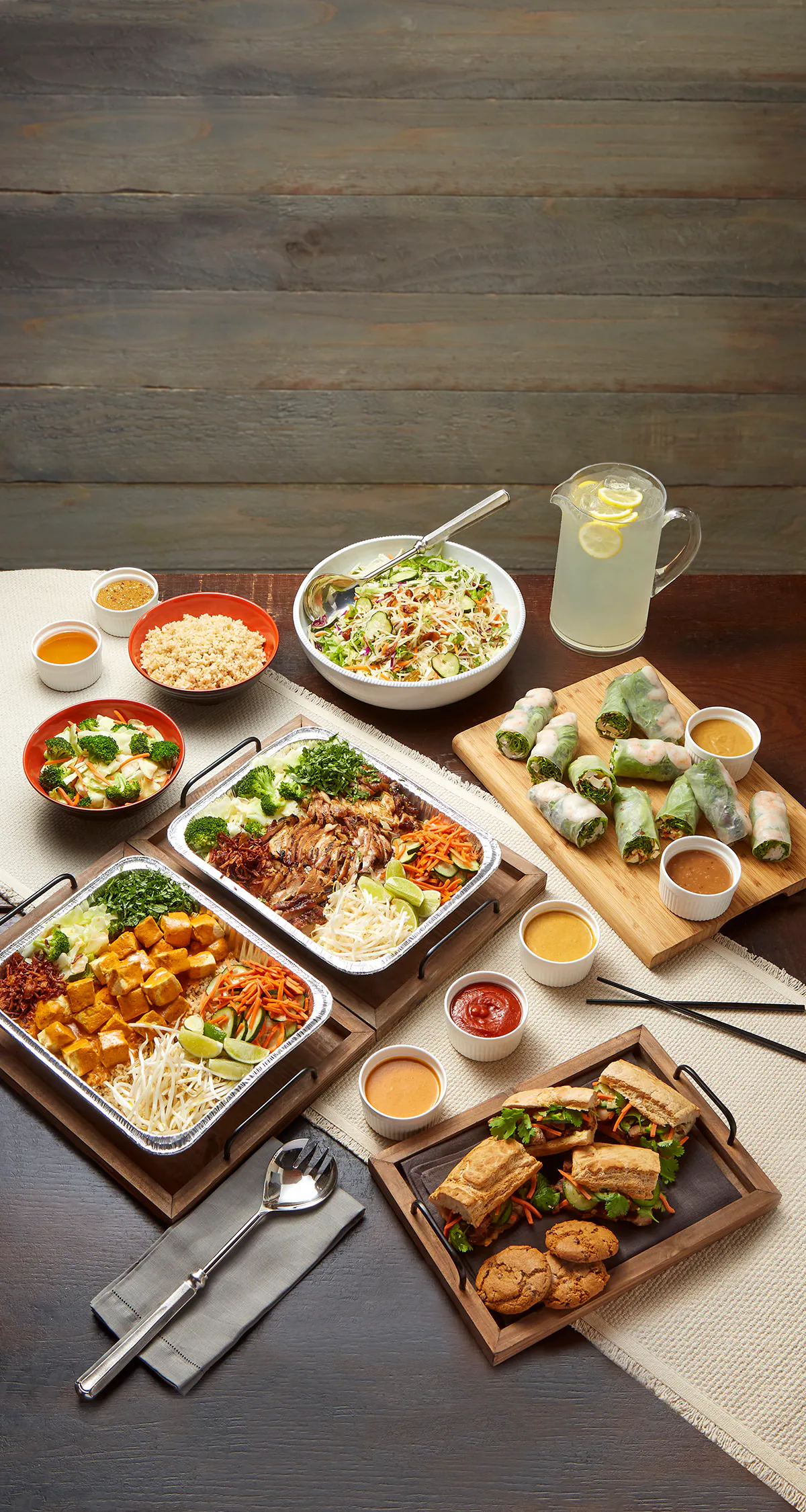 a bunch of food sitting on top of a wooden table