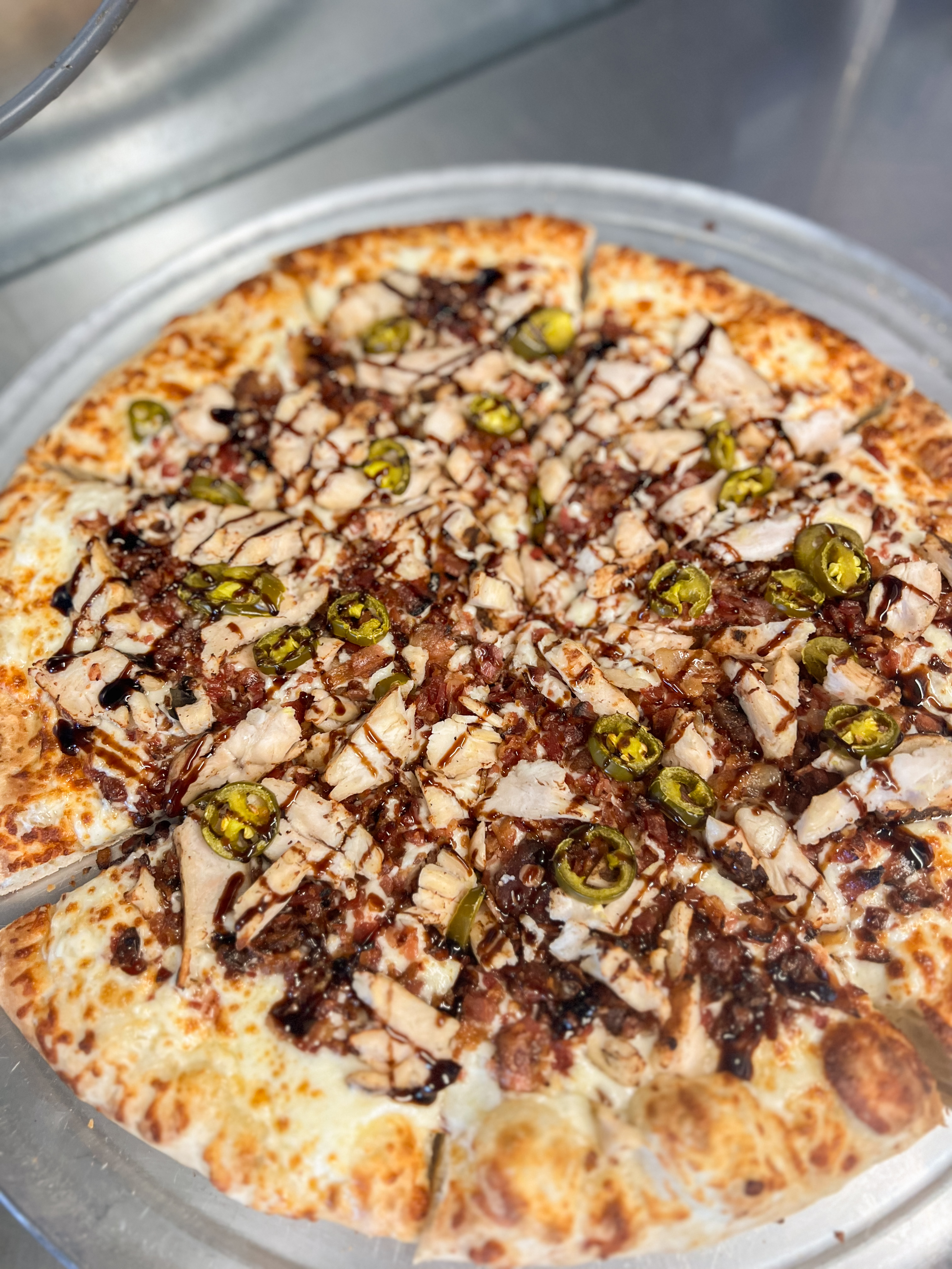 a pizza sitting on top of a pan on a table