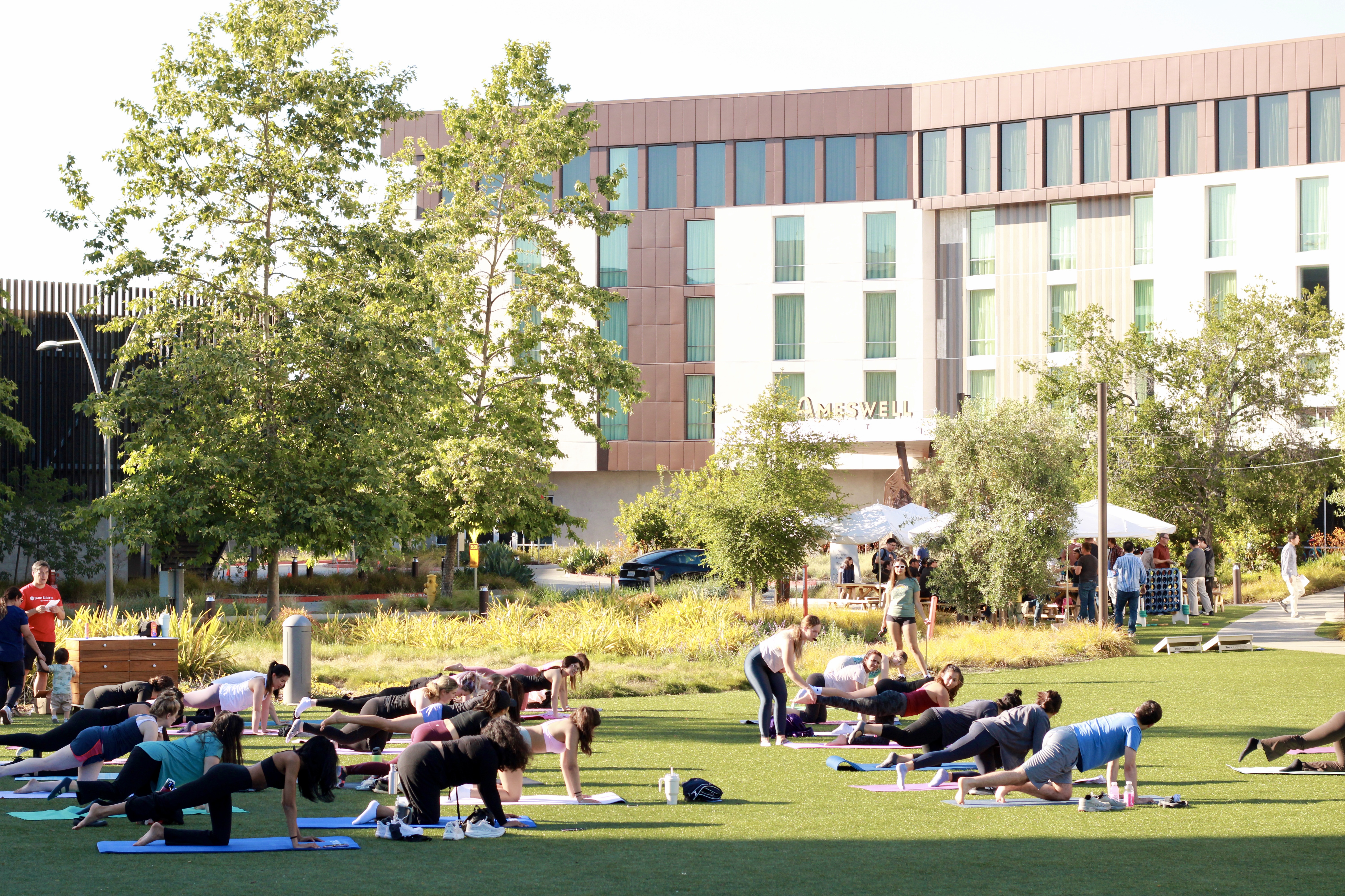 a group of people sitting at a park