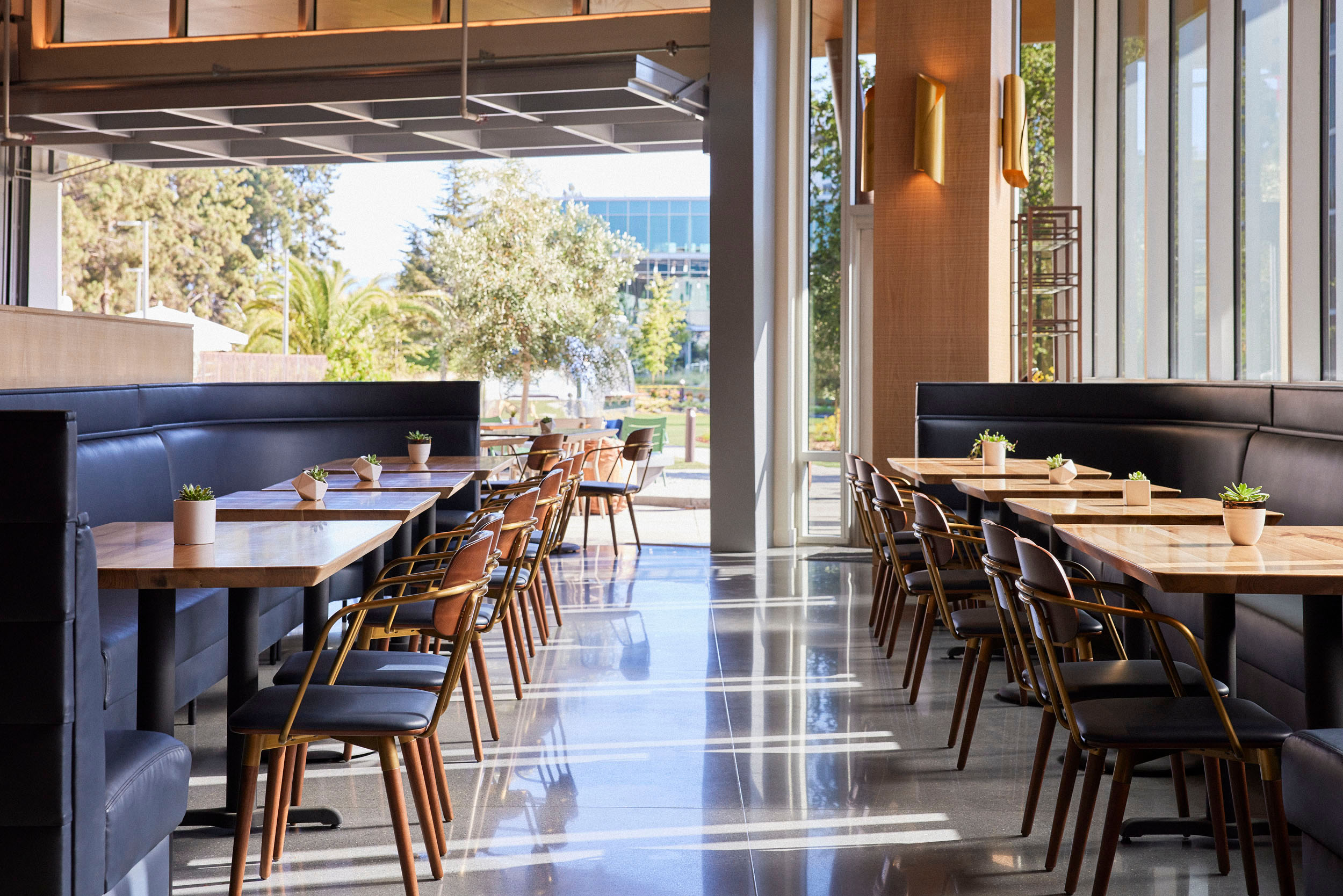 a dining room table in front of a window