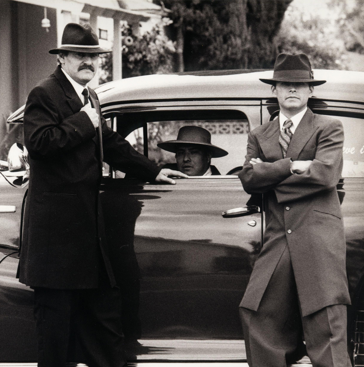 a couple of people that are standing in the rain