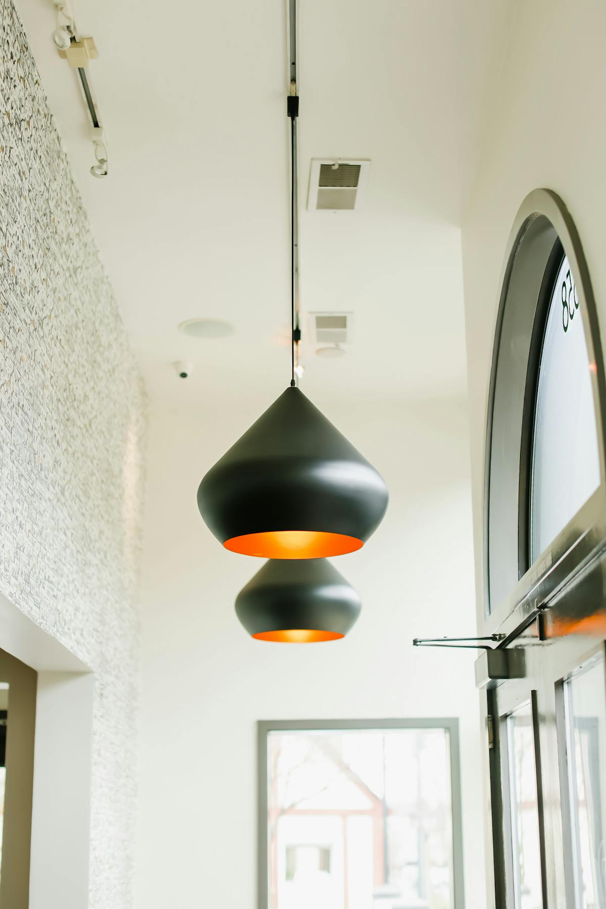 An indoor view of two lamps.