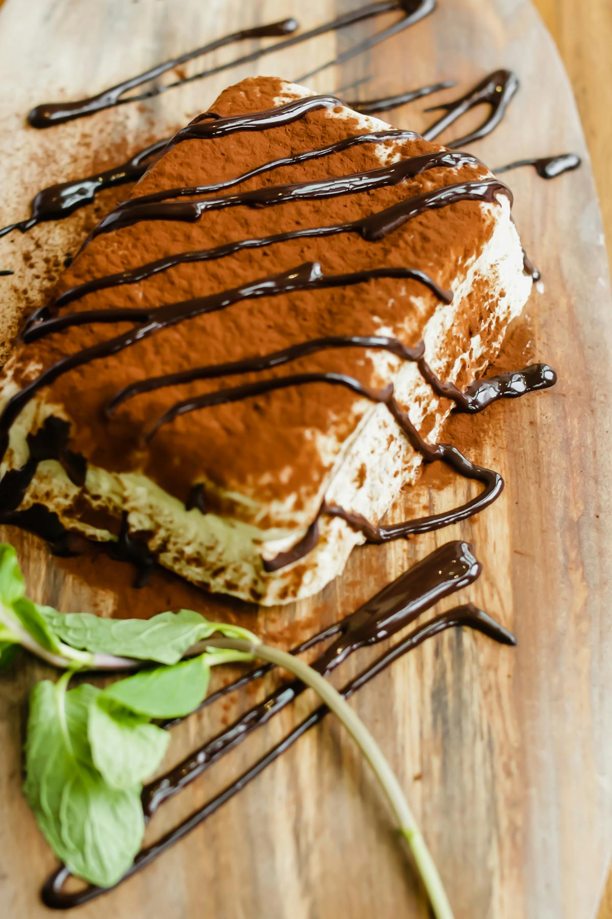 a piece of cake sitting on top of a wooden cutting board