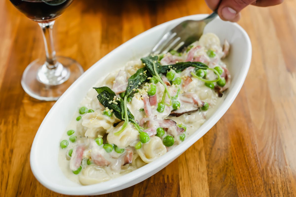 a plate of pasta on a table.