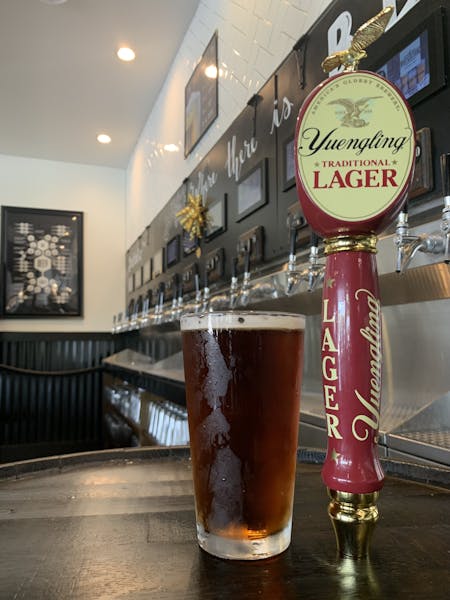 a glass of beer on a table