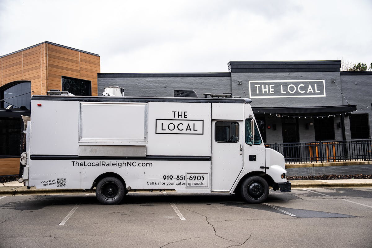 a truck is parked in front of a building