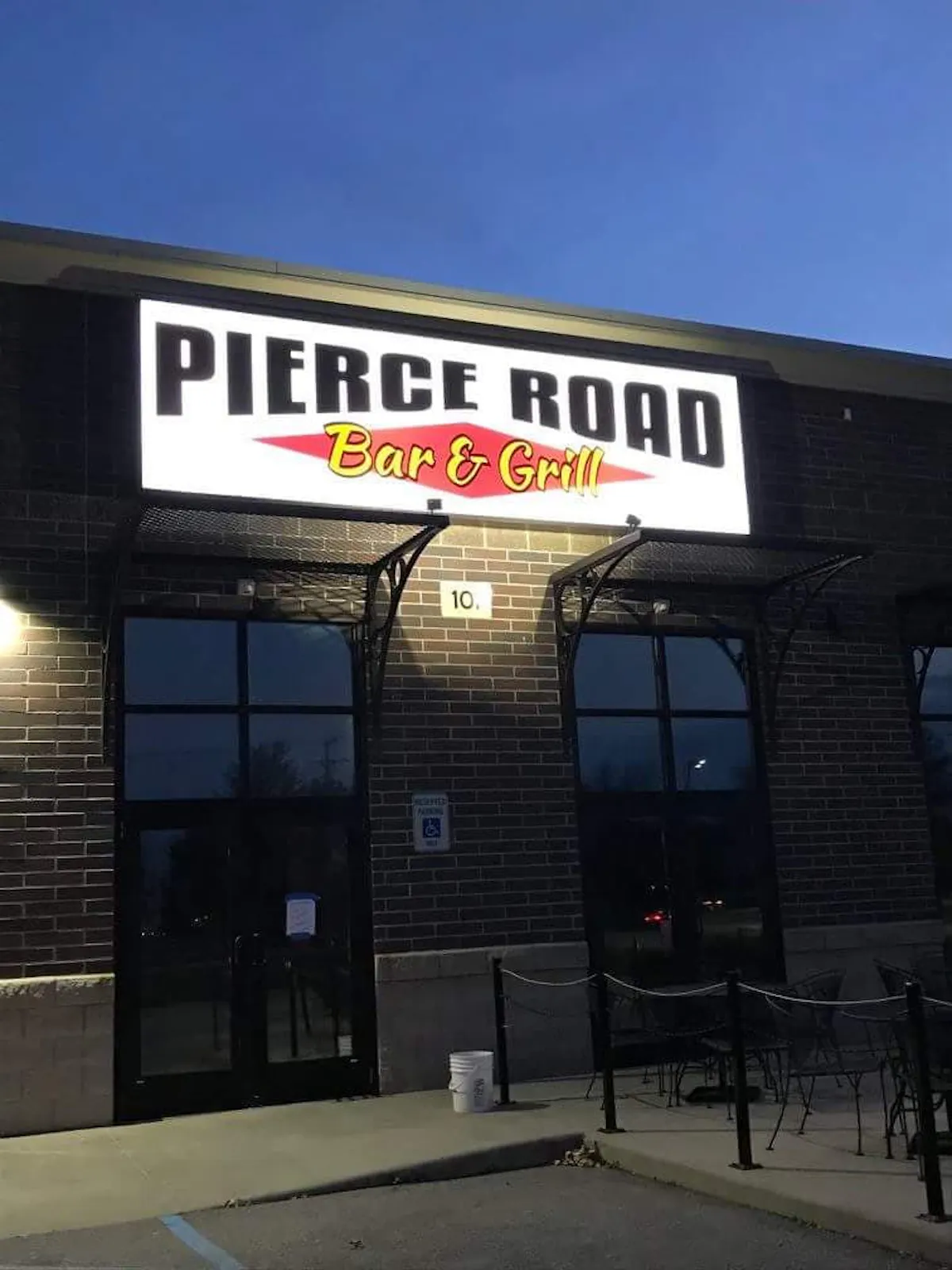 a sign above a store in a brick building
