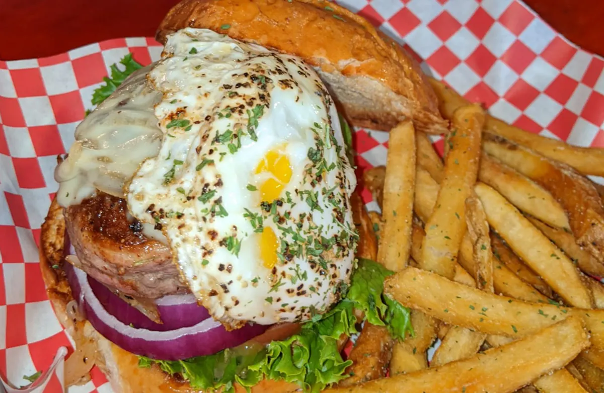 a basket of fries and a sandwich on a plate