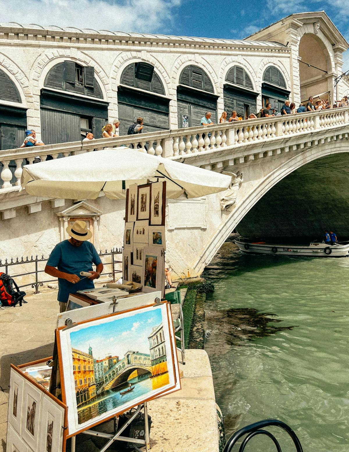 a person standing in front of a bridge