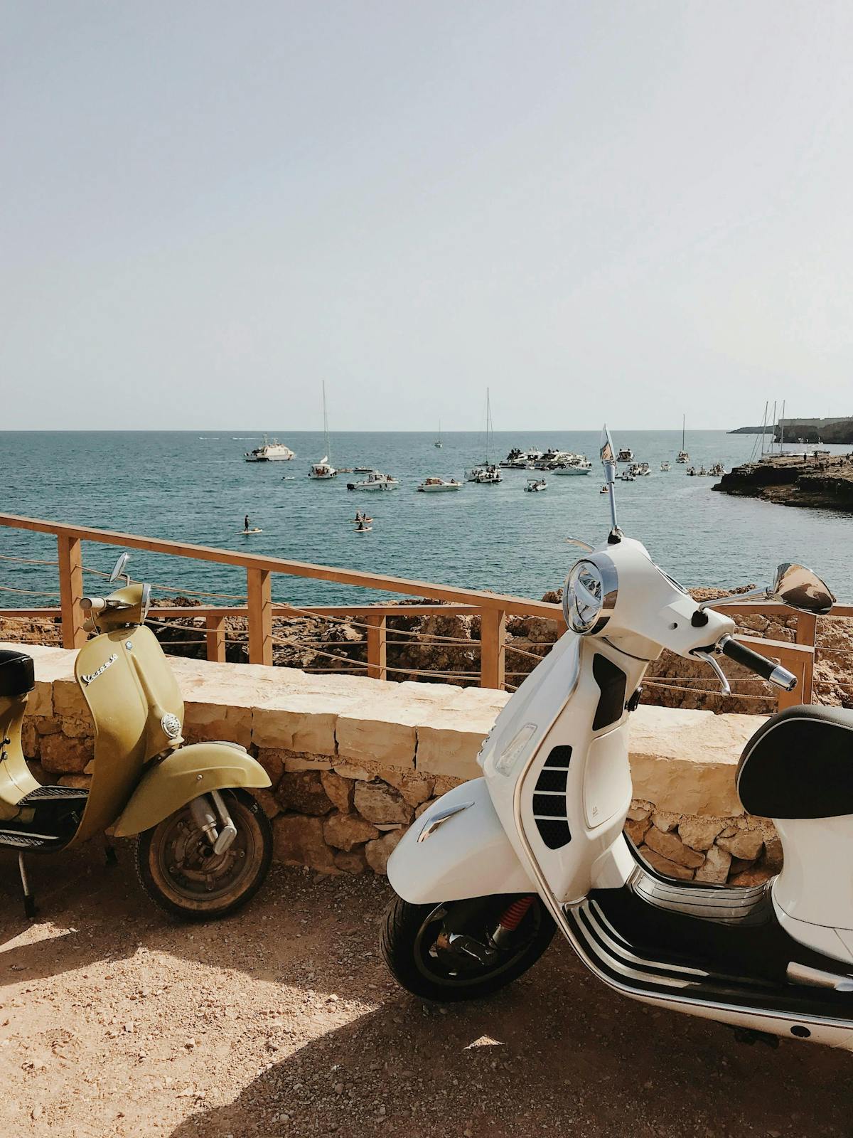 a boat sitting on top of a sandy beach
