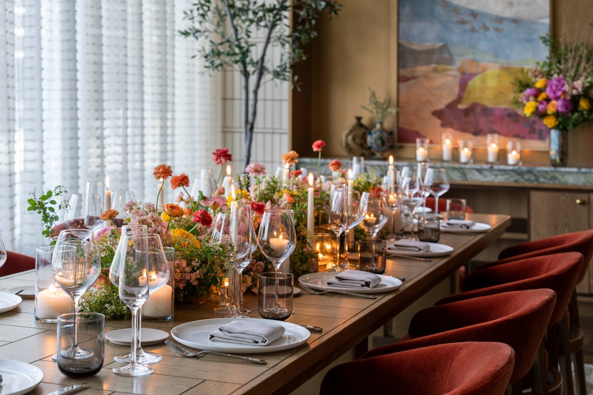 a dining table filled with wine glasses