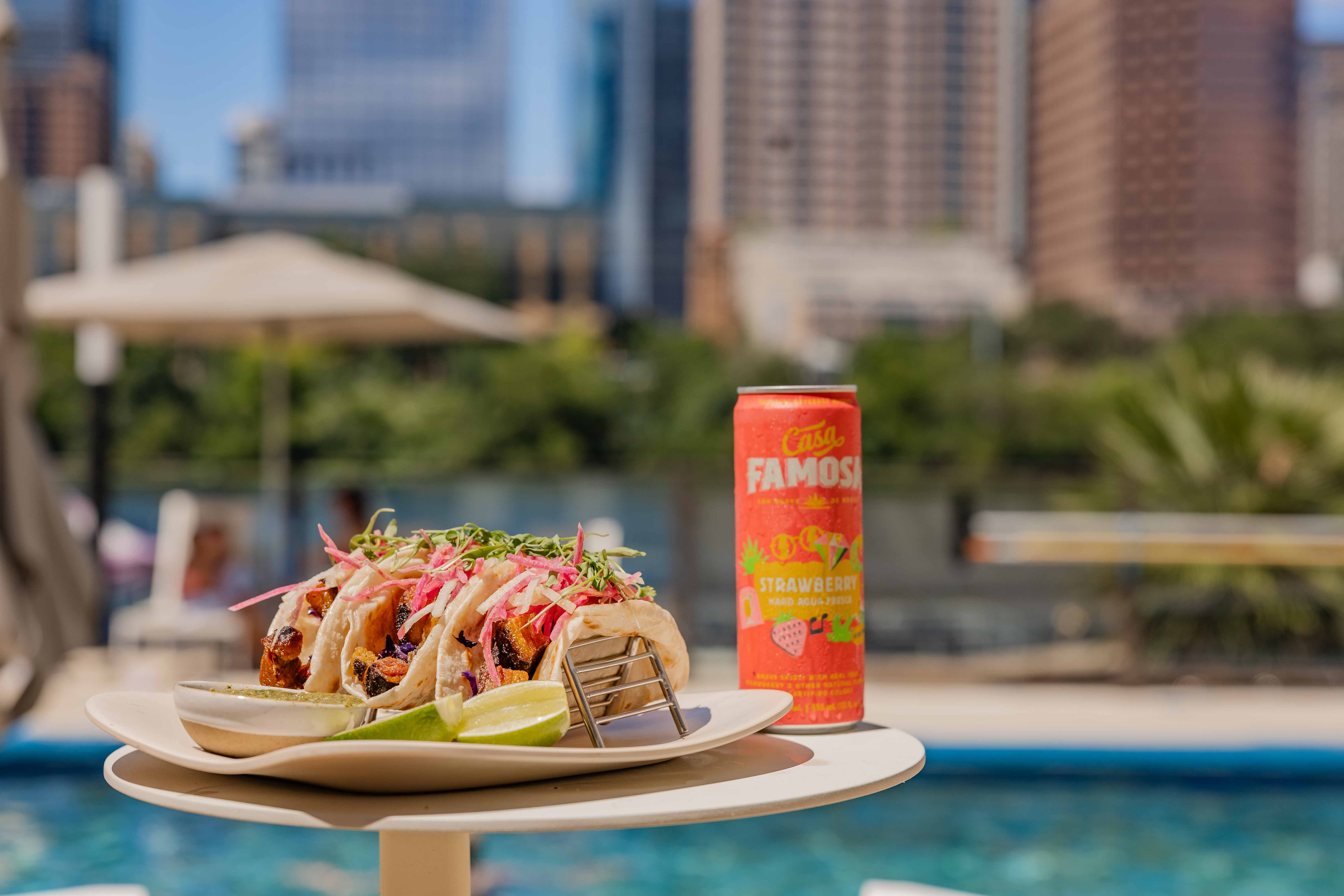 a tacos and a can of strawberry juice