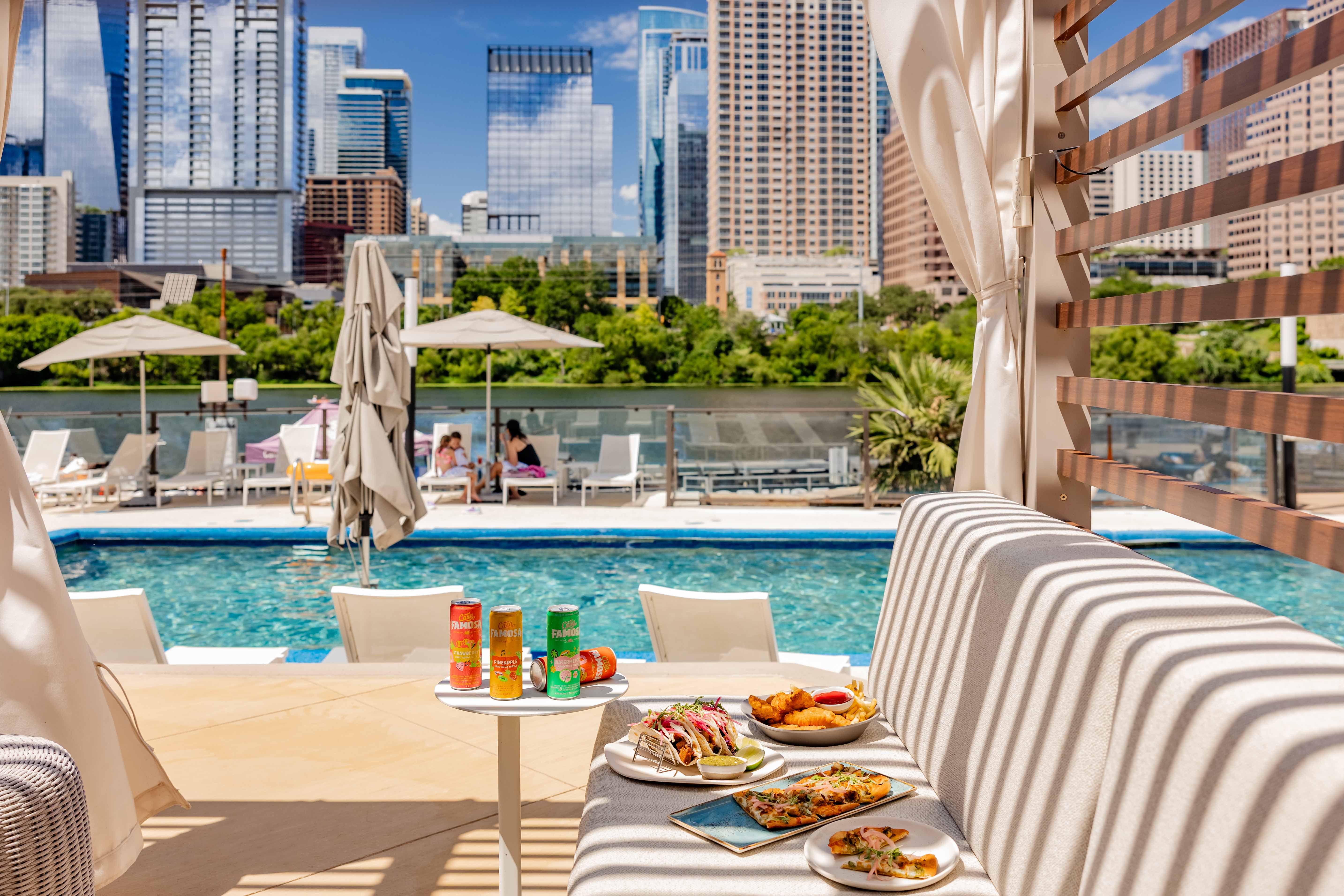 a table with food on it by a pool