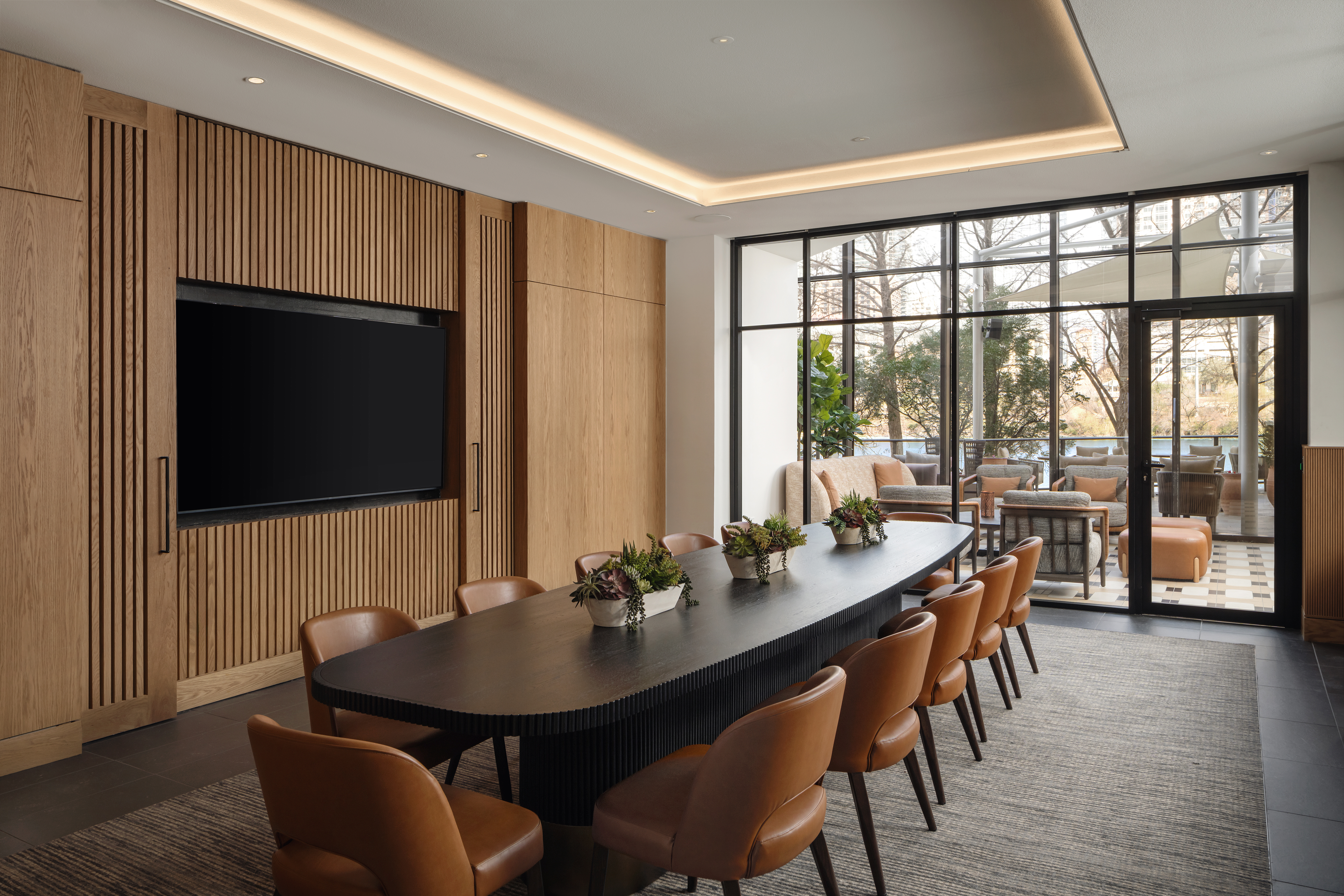 a room with a large table and chairs