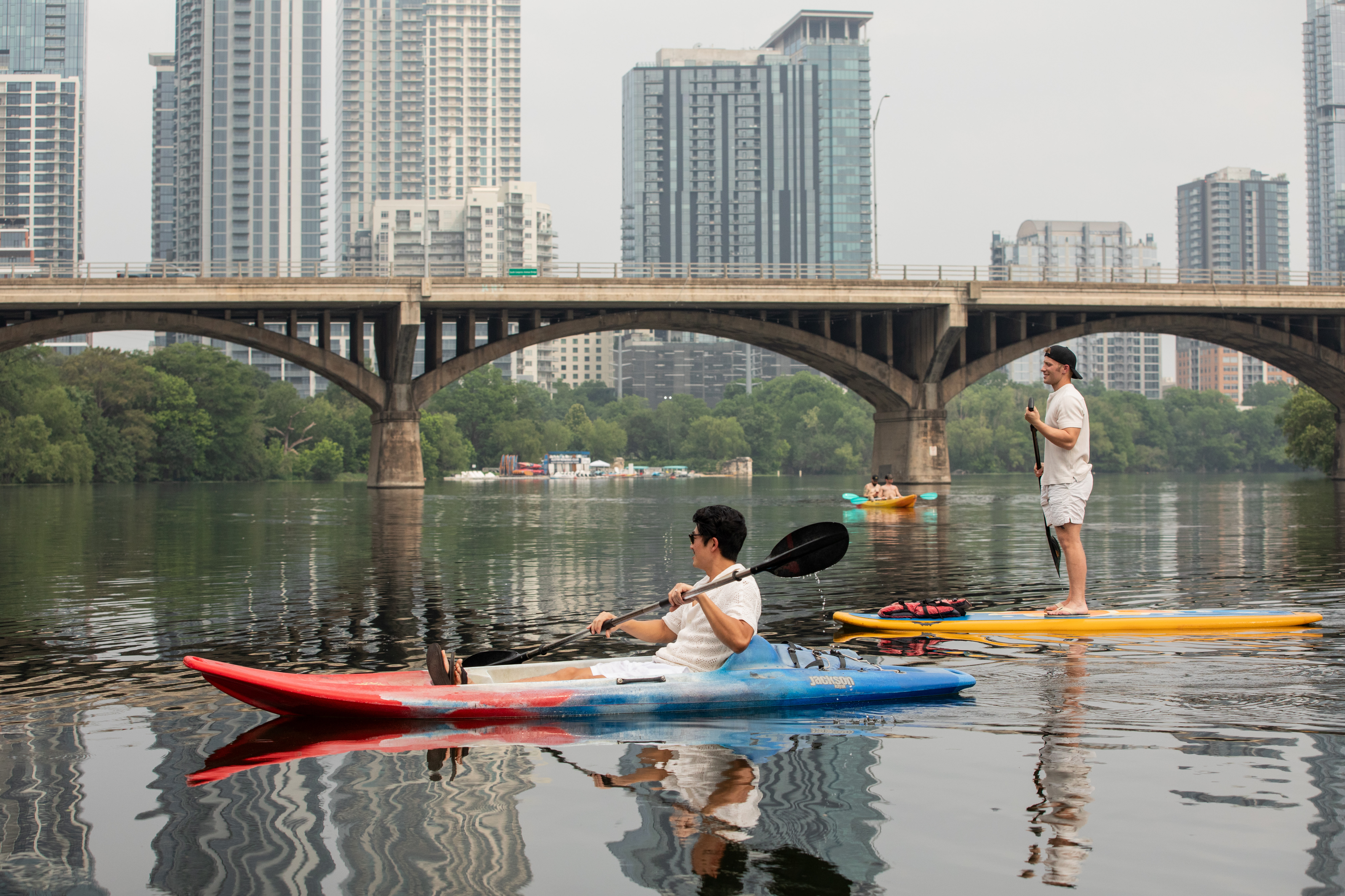 a group of people on kayaks on a river