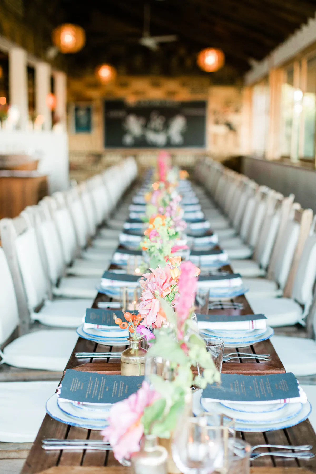 a row of wooden benches sitting on top of a table