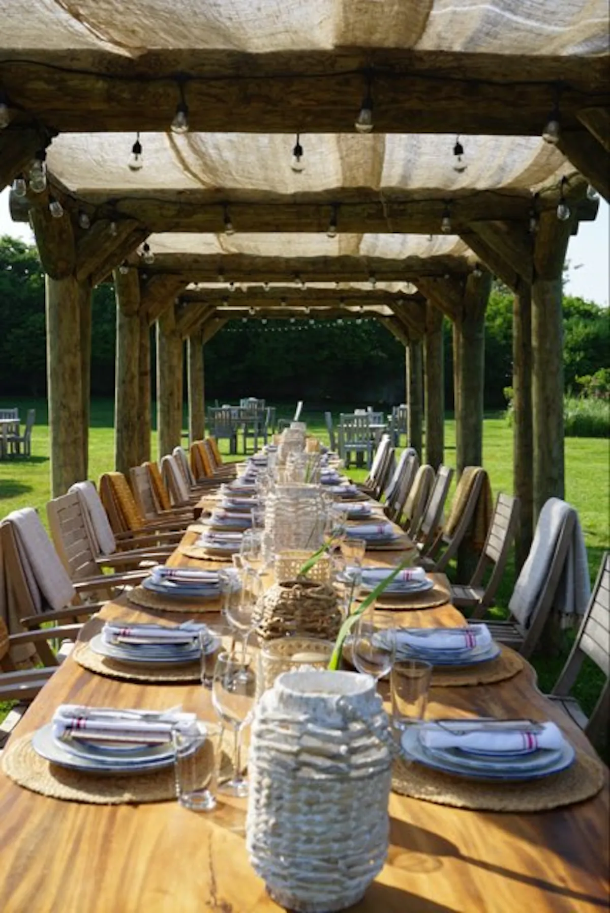 a group of lawn chairs sitting on top of a wooden table